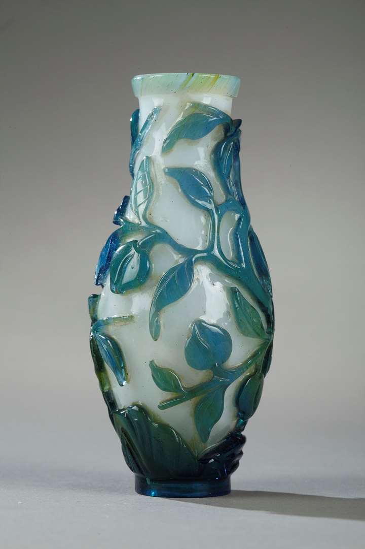 Small vase overlay glass turquoise blue, green on ground white opaque decorated with longevity peach and foliage